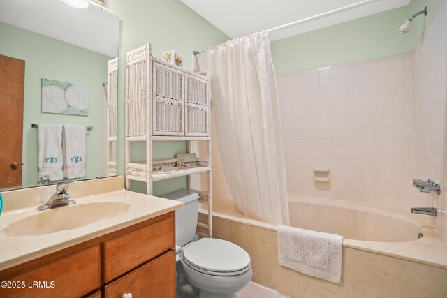 full bath with vanity, tile patterned flooring, shower / bath combo with shower curtain, and toilet