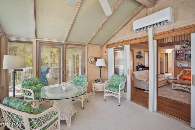 sunroom / solarium featuring an AC wall unit and beam ceiling