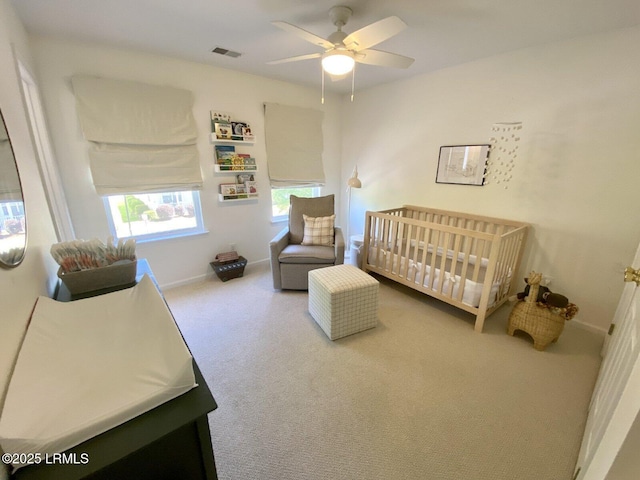 15 6th Ave, Bluffton, SC 29910 - bedroom with carpet floors, a nursery area, baseboards, and ceiling fan