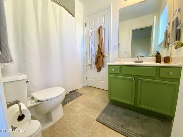 15 6th Ave, Bluffton, SC 29910 - bathroom featuring toilet, vanity, and tile patterned floors