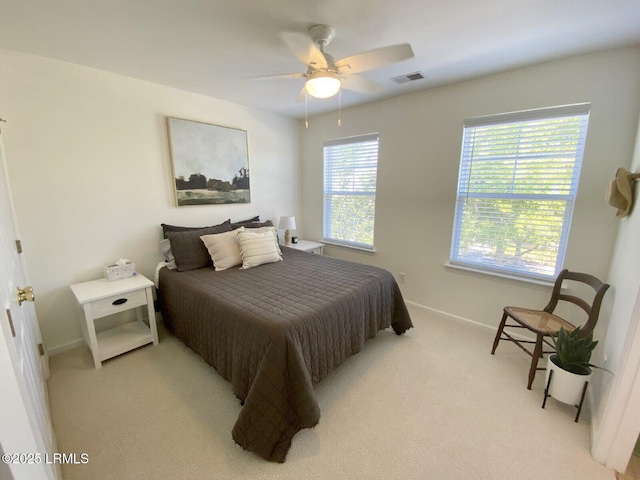 15 6th Ave, Bluffton, SC 29910 - bedroom with light colored carpet, baseboards, and a ceiling fan