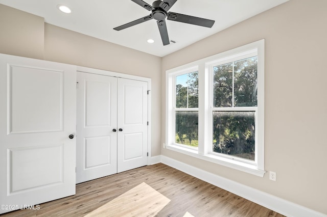 100 Battery Creek Club Dr, Beaufort, SC 29902 - unfurnished bedroom featuring baseboards, light wood-style floors, a closet, recessed lighting, and ceiling fan