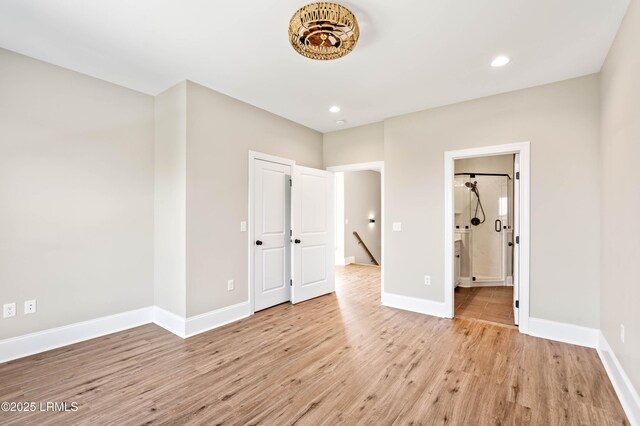 100 Battery Creek Club Dr, Beaufort, SC 29902 - unfurnished bedroom featuring light wood-type flooring, baseboards, recessed lighting, and ensuite bathroom