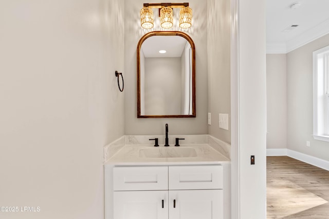 100 Battery Creek Club Dr, Beaufort, SC 29902 - bathroom featuring wood finished floors, vanity, ornamental molding, and baseboards