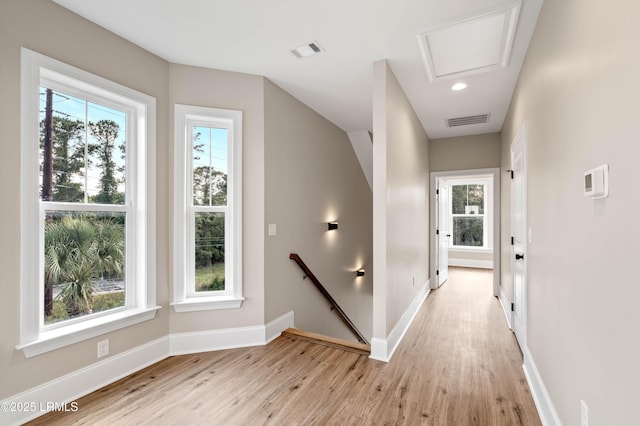 100 Battery Creek Club Dr, Beaufort, SC 29902 - hall with an upstairs landing, light wood-style flooring, and baseboards