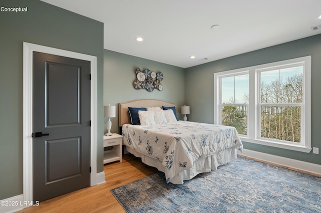 bedroom with light hardwood / wood-style floors