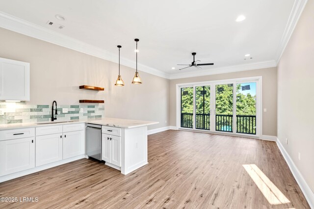 100 Battery Creek Club Dr, Beaufort, SC 29902 - kitchen with a sink, dishwasher, a ceiling fan, a peninsula, and decorative backsplash