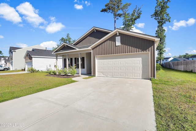 171 Great Bend Dr, Beaufort, SC 29906 - view of front of house featuring an attached garage, driveway, fence, and a front yard