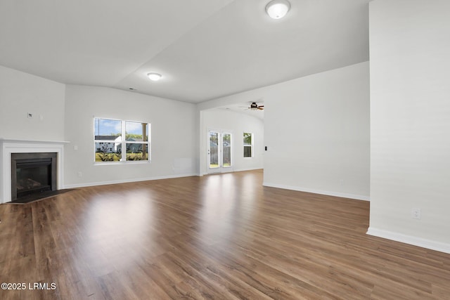171 Great Bend Dr, Beaufort, SC 29906 - unfurnished living room with a fireplace with flush hearth, vaulted ceiling, wood finished floors, and baseboards