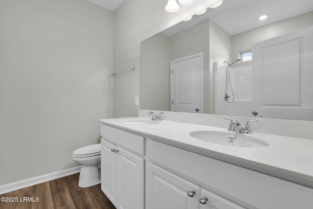 171 Great Bend Dr, Beaufort, SC 29906 - bathroom with toilet, wood finished floors, a sink, and double vanity