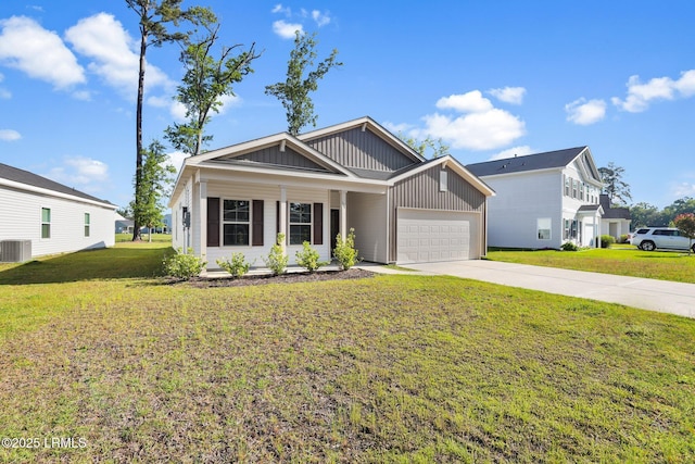 171 Great Bend Dr, Beaufort, SC 29906 - view of front of property with a front lawn, central air condition unit, board and batten siding, driveway, and a garage
