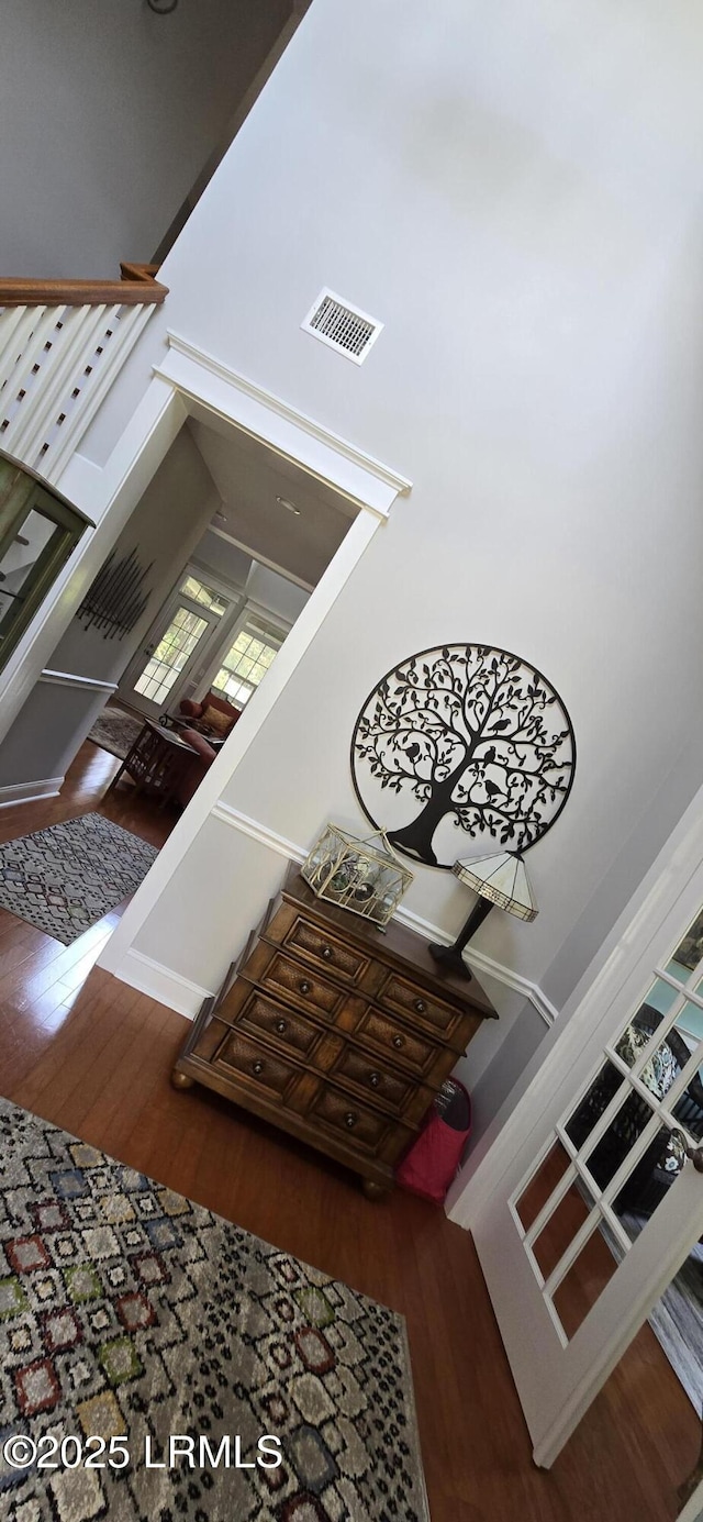 staircase featuring wood finished floors