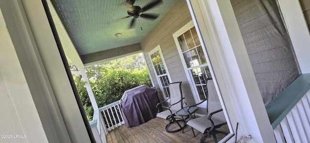 deck with covered porch and ceiling fan