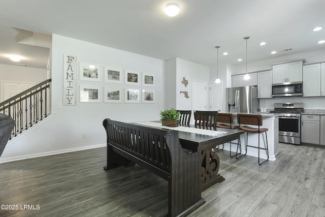 74 Keowee Ln, Beaufort, SC 29906 - dining area featuring wood finished floors, recessed lighting, and stairs