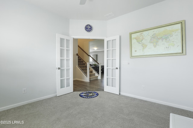 74 Keowee Ln, Beaufort, SC 29906 - empty room featuring french doors, carpet floors, stairs, and a ceiling fan