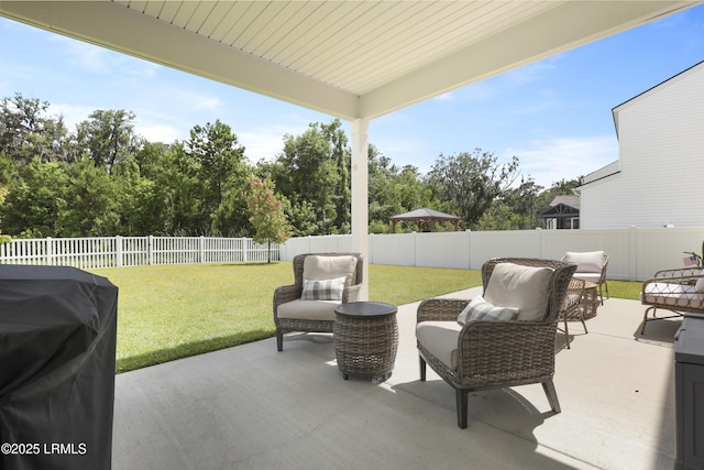 74 Keowee Ln, Beaufort, SC 29906 - fenced backyard featuring a patio, a grill, and an outdoor hangout area