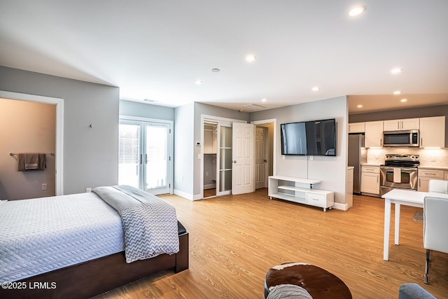 1348 Rowland Dr, Saint Helena Island, SC 29920 - bedroom with light wood-type flooring, stainless steel refrigerator, and french doors