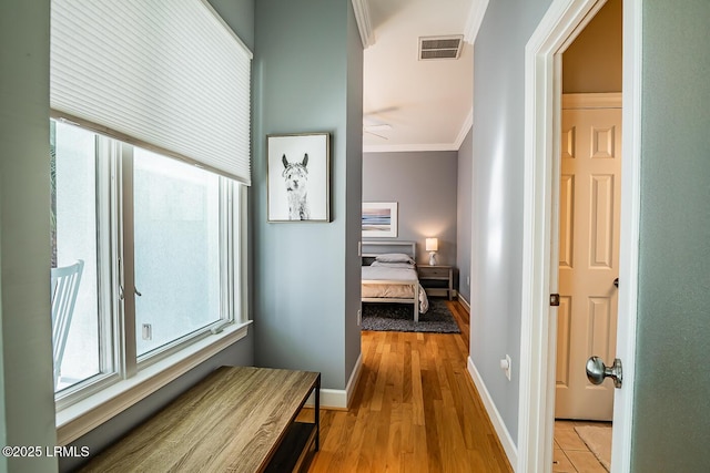 1348 Rowland Dr, Saint Helena Island, SC 29920 - corridor with ornamental molding and light hardwood / wood-style floors