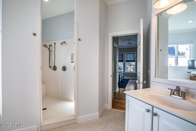 1348 Rowland Dr, Saint Helena Island, SC 29920 - bathroom featuring crown molding, vanity, tile patterned flooring, and a shower