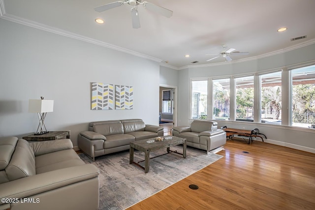 1348 Rowland Dr, Saint Helena Island, SC 29920 - living room with ornamental molding, ceiling fan, and light wood-type flooring