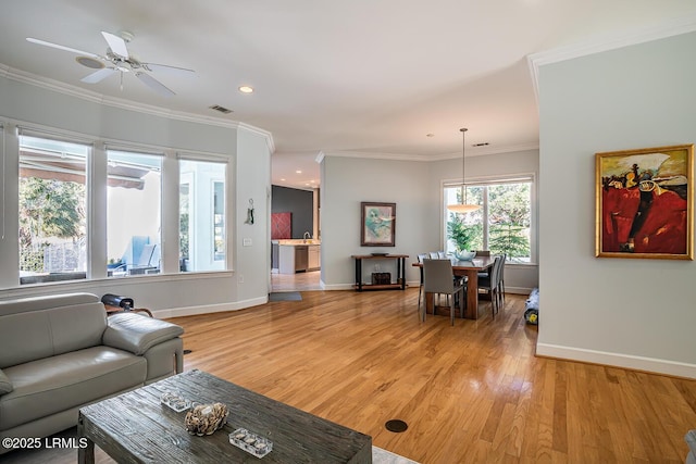 1348 Rowland Dr, Saint Helena Island, SC 29920 - living room with crown molding, ceiling fan, and light hardwood / wood-style floors