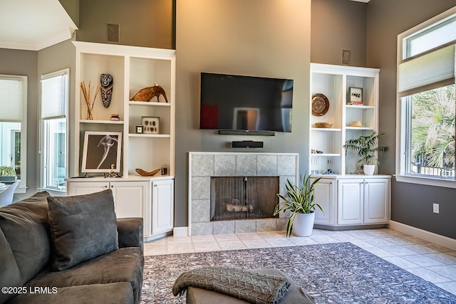 1348 Rowland Dr, Saint Helena Island, SC 29920 - tiled living room featuring built in shelves and a fireplace