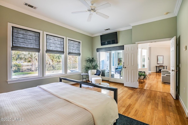 1348 Rowland Dr, Saint Helena Island, SC 29920 - bedroom featuring ceiling fan, ornamental molding, access to exterior, and light wood-type flooring