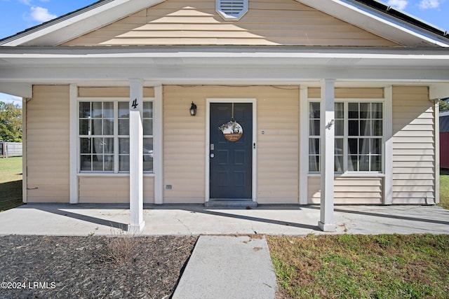 property entrance featuring covered porch