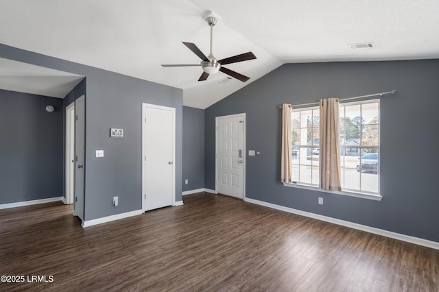 interior space with dark wood-type flooring, ceiling fan, and lofted ceiling