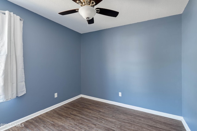 spare room featuring hardwood / wood-style flooring, ceiling fan, and a textured ceiling