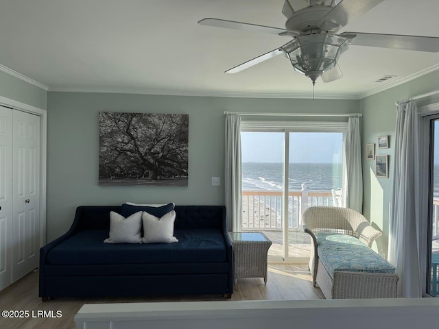 108 Harbor Dr N, Harbor Island, SC 29920 - living room featuring wood finished floors, ornamental molding, a water view, and a ceiling fan