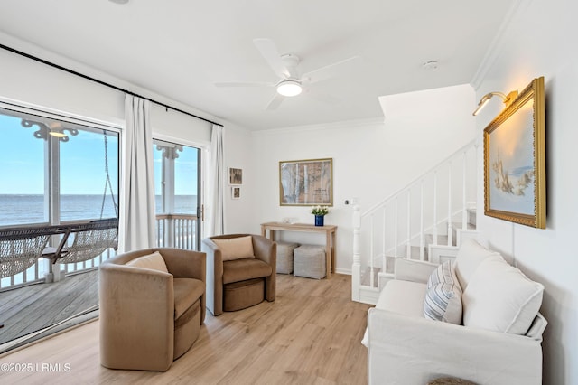 108 Harbor Dr N, Harbor Island, SC 29920 - living room with a water view, ornamental molding, light wood finished floors, stairs, and ceiling fan