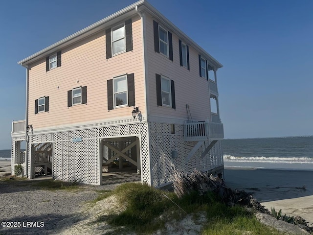 108 Harbor Dr N, Harbor Island, SC 29920 - rear view of property with stairway and view of water and beach