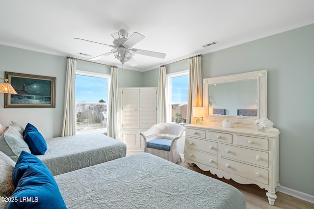 108 Harbor Dr N, Harbor Island, SC 29920 - bedroom featuring crown molding, wood finished floors, ceiling fan, and baseboards