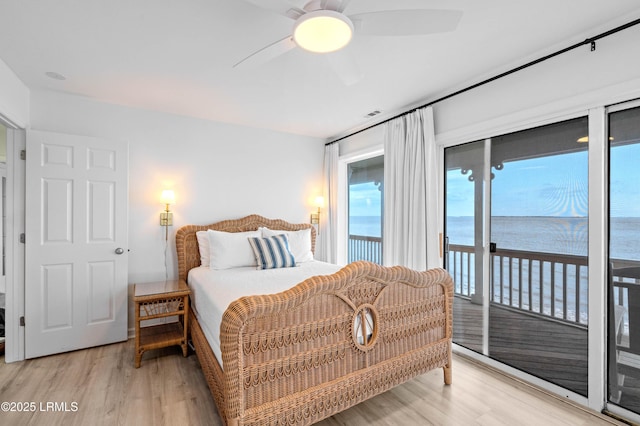 108 Harbor Dr N, Harbor Island, SC 29920 - bedroom with light wood-style floors, access to outside, a water view, and ceiling fan