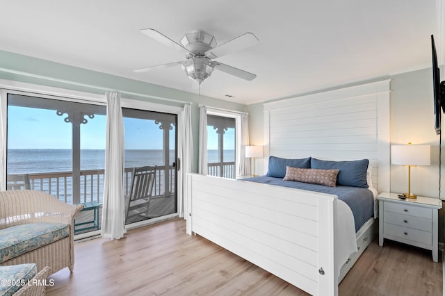 108 Harbor Dr N, Harbor Island, SC 29920 - bedroom featuring access to exterior, a water view, light wood-type flooring, a ceiling fan, and ornamental molding