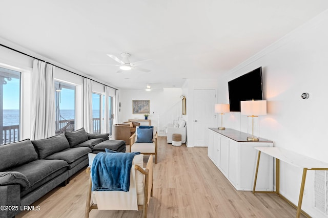 108 Harbor Dr N, Harbor Island, SC 29920 - living room featuring ceiling fan, stairway, light wood-style flooring, and a water view