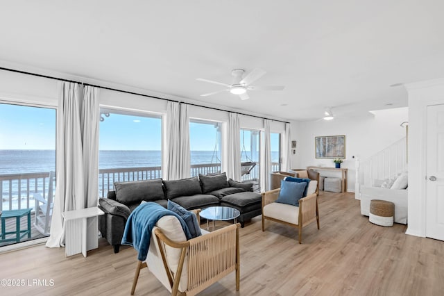 108 Harbor Dr N, Harbor Island, SC 29920 - living area with ceiling fan, a water view, light wood-type flooring, and stairs