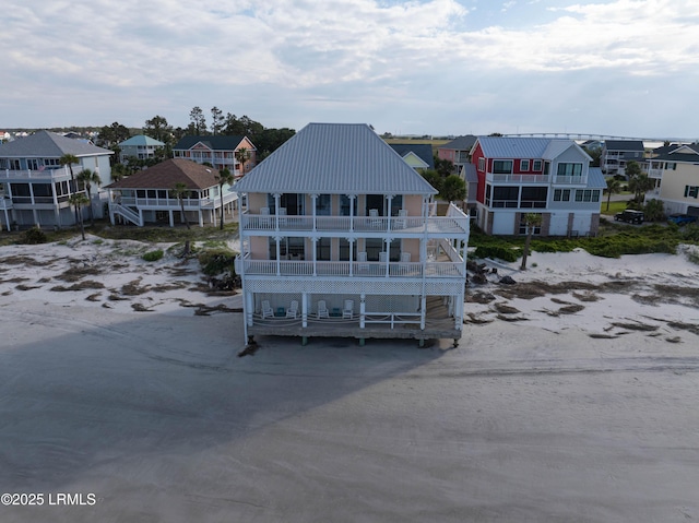 108 Harbor Dr N, Harbor Island, SC 29920 - rear view of house featuring a balcony, a residential view, and metal roof