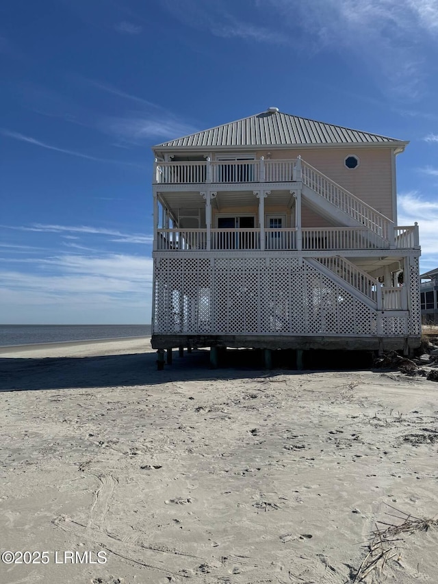 108 Harbor Dr N, Harbor Island, SC 29920 - view of front of house featuring metal roof and a water view