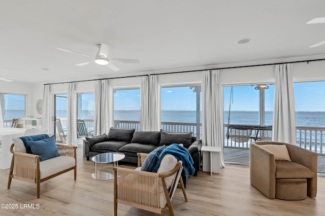 108 Harbor Dr N, Harbor Island, SC 29920 - living room featuring a ceiling fan, a water view, and light wood-type flooring