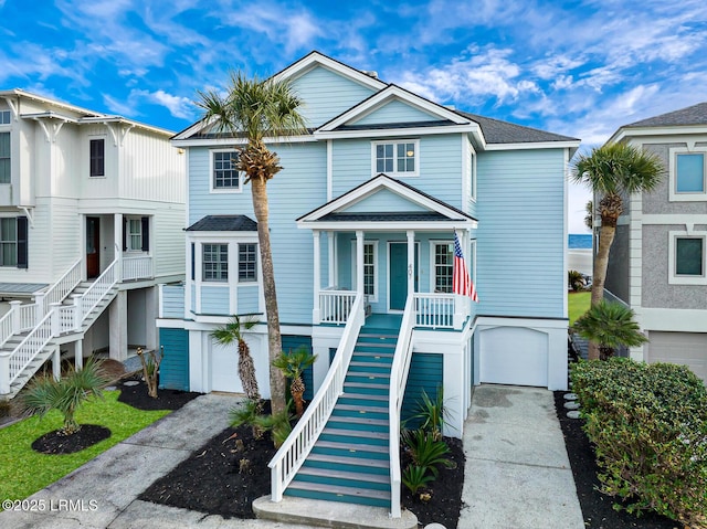 view of front of house featuring a porch and a garage