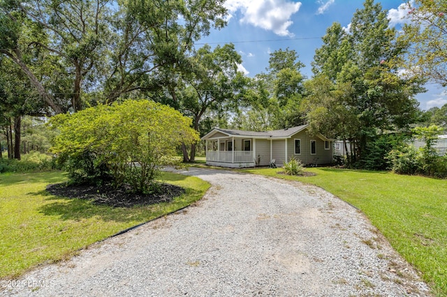 7058 Roseida Rd, Beaufort, SC 29906 - view of front of property with driveway, a front lawn, and a porch