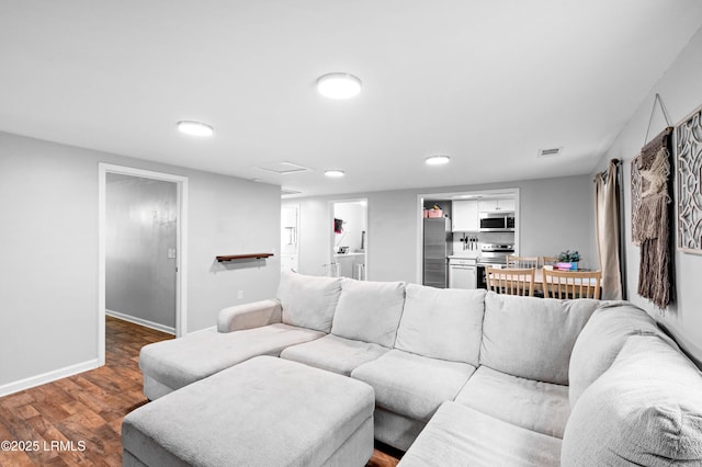 7058 Roseida Rd, Beaufort, SC 29906 - living area with wood finished floors, recessed lighting, and washer / clothes dryer