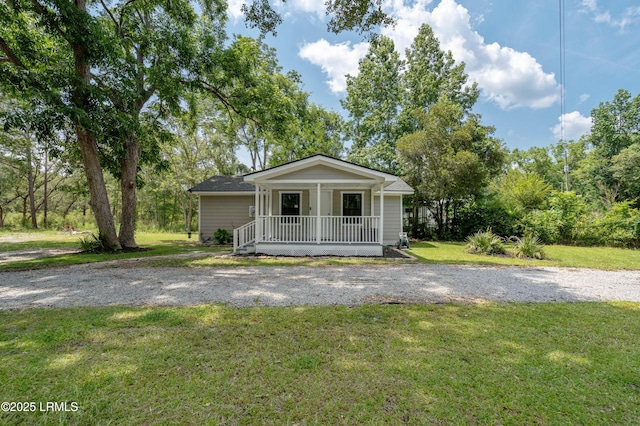 7058 Roseida Rd, Beaufort, SC 29906 - bungalow-style home with covered porch and a front lawn