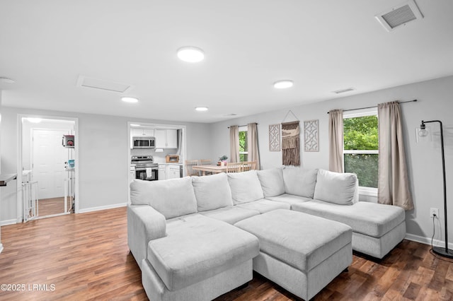 7058 Roseida Rd, Beaufort, SC 29906 - living room with healthy amount of natural light, wood finished floors, attic access, and recessed lighting