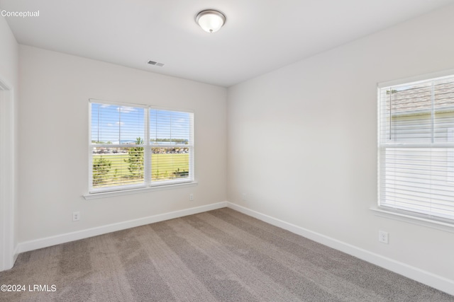 unfurnished room with carpet floors