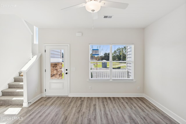 entrance foyer with ceiling fan and light wood-type flooring