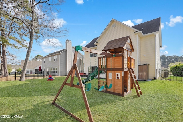 view of jungle gym with a yard and fence