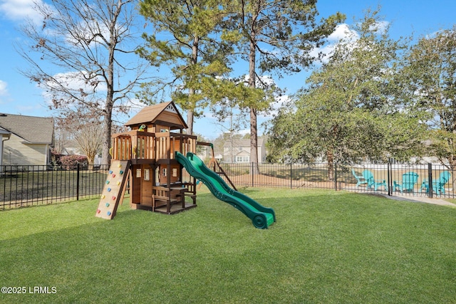 view of playground featuring a yard and fence